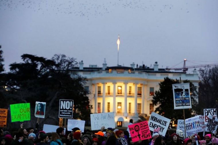 Demonstrators take part in the Women's March to protest Donald Trump's inauguration as the 45th president of the United States close to the White House in Washington, January 21, 2017.