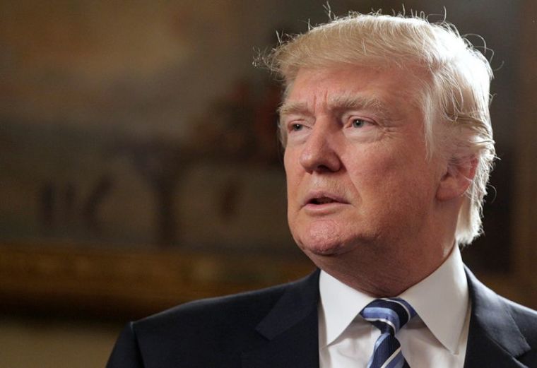 U.S. President Donald Trump speaks during the Inaugural Law Enforcement Officers and First Responders Reception in the Blue Room of the White House in Washington, January 22, 2017.