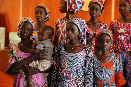 One of the 21 Chibok school girls released by Boko Haram carries her baby during their visit to meet President Muhammadu Buhari In Abuja, Nigeria October 19, 2016.