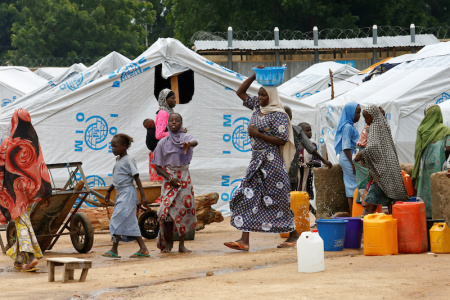 Women gather at a water collecting point at the internally displaced people's camp in Bama, Borno State, Nigeria, August 31, 2016.