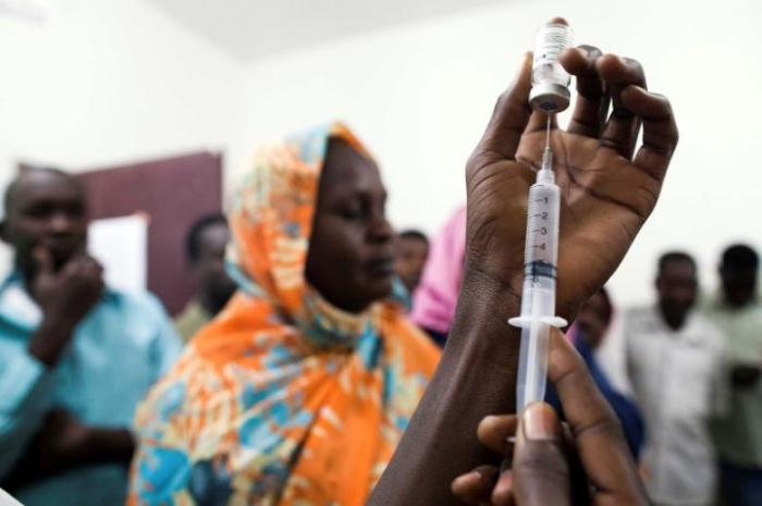 File: Staff members of the Teaching Hospital receive the first vaccination treatment for yellow fever in El Geneina, West Darfur, Sudan, in this November 14, 2012 handout.