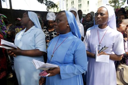 Christians take part in a re-enactment of the crucifixion of Jesus Christ on Good Friday along a road near St. Leo's Catholic church in Lagos, Nigeria, March 25, 2016.