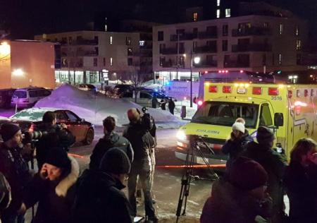 An ambulance is parked at the scene of a fatal shooting at the Quebec Islamic Cultural Centre in Quebec City, Canada January 29, 2017.