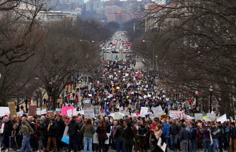 Activists march to the US Capitol to protest President Donald Trump's executive actions on immigration in Washington, D.C., January 29, 2017.