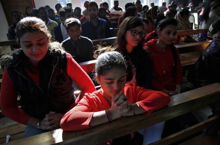 People pray at a church during Christmas celebrations in Chandigarh, India, December 25, 2015.