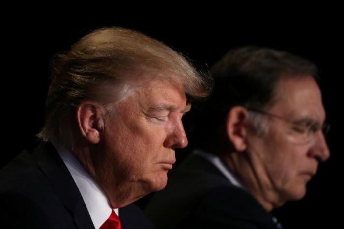 U.S. President Donald Trump prays during the National Prayer Breakfast event in Washington, U.S., February 2, 2017.