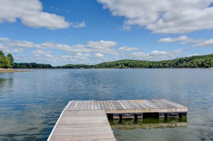 The lake front view of the luxurious lodge at 391 Woodstone Trail in Bethel, New York, that you can win with a 200-word essay.