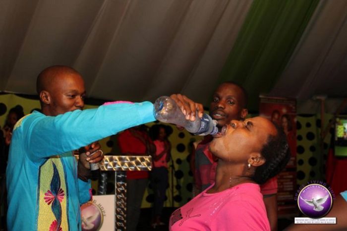 Pastor Light Monyeki gives a congregant water mixed with Rattex.