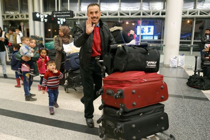 Members of a Syrian refugee family walk with their luggage at Beirut international airport ahead of their travel to the United States from Lebanon, February 8, 2017.