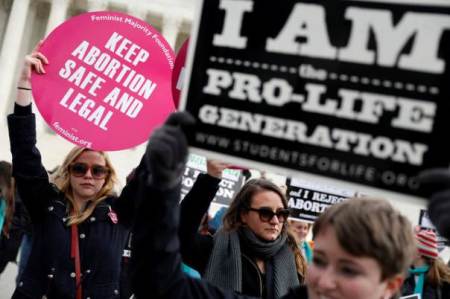 Pro-life and pro-choice activists gather at the Supreme Court for the National March for Life rally in Washington January 27, 2017.