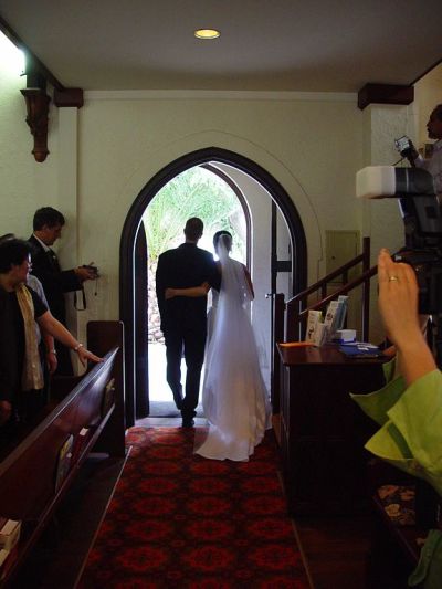 A newly married couple exits the church of St. Johns Lutheran.