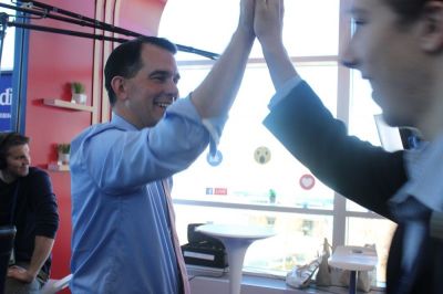 Wisconsin Gov. Scott Walker high-fives fans during an event organized by the Independent Journal Review at the Conservative Political Action Conference in Oxon Hill, Maryland on Feb. 23, 2017.