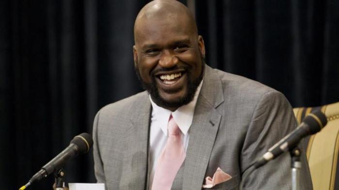 Shaquille O'Neal laughs while telling a story during his announcement of his retirement from the National Basketball Association (NBA) at a news conference at his home in Windermere, Florida June 3, 2011.