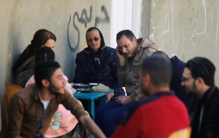 Christian families who left from Al-Arish city North Sinai's Governorate capital after the escalation of a campaign targeting Christians by Islamic State militants last week, eat lunch after arriving at the Saint Church in Ismailia, northeast of Cairo, Egypt, February 27, 2017.