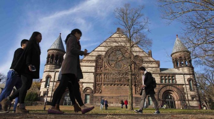 People walk around the Princeton University campus in New Jersey, November 16, 2013.