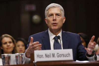 With his wife Marie Louise (L) looking on, U.S. Supreme Court nominee judge Neil Gorsuch testifies during a third day of his Senate Judiciary Committee confirmation hearing on Capitol Hill in Washington, U.S., March 22, 2017.