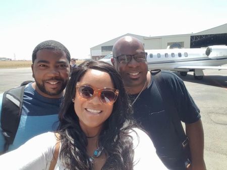 Shirnae McFarlane (C) Pastor Chris Hill (R) and her husband Arthur McFarlane (L)