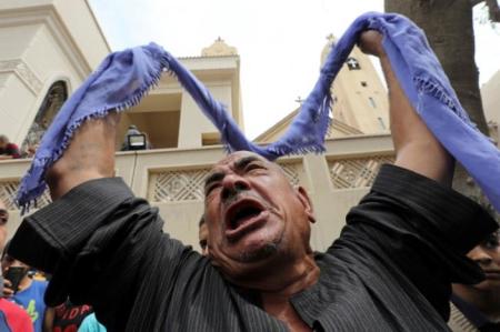 A relative of one of the victims reacts after a church explosion killed at least 21 in Tanta, Egypt, April 9, 2017.