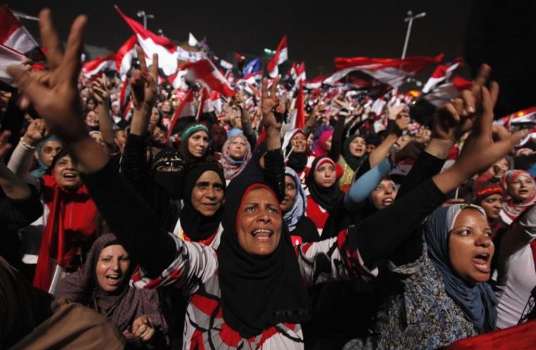 Protesters, who are against Egyptian President Mohamed Mursi, gesture in Tahrir Square in Cairo July 3, 2013.