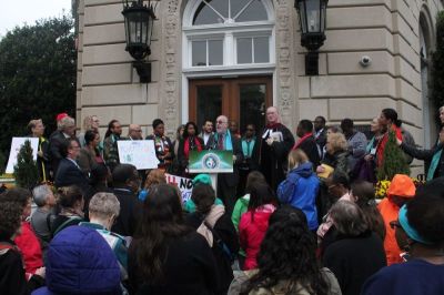 Patrick Carolan, the executive director of Franciscan Action Network, speaks during a demonstration against President Donald Trump's budget proposal outside of the United Methodist Building in Washington, D.C. on April 24, 2017.