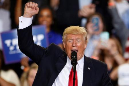 U.S. President Donald Trump appears on stage at a rally in Harrisburg, Pennsylvania on April 29, 2017.