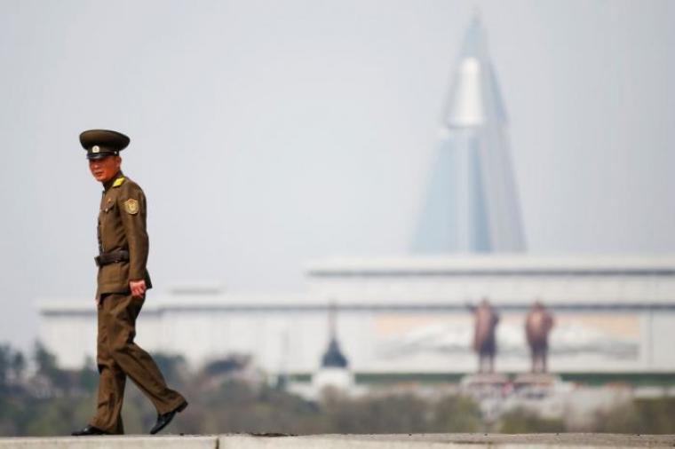 A soldier walks on the bank of the river in central Pyongyang, North Korea April 16, 2017.