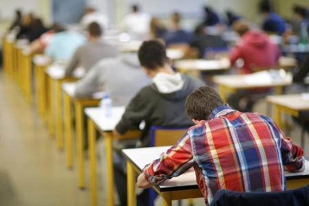 Third-year students taking a test.