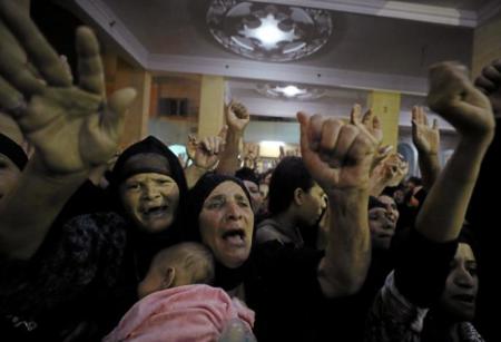 Relatives of victims of an attack that killed at least Coptic Christians on Friday react at the funeral in Minya, Egypt, May 26, 2017.