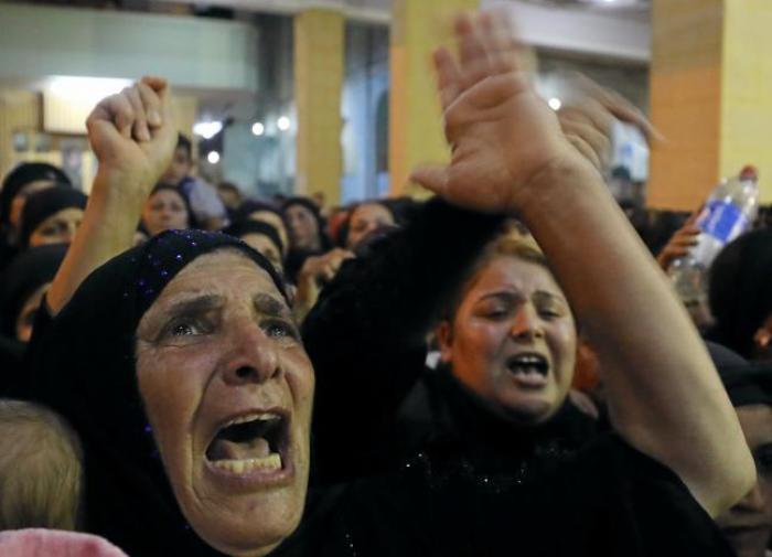 Relatives of victims of a terrorist attack that killed at least 30 Coptic Christians react at the funeral in Minya, Egypt on May 26, 2017.