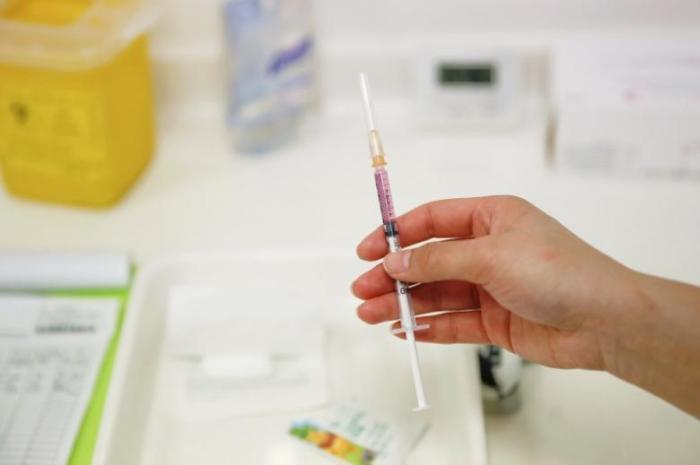 A nurse prepares a vaccine to be given to a child in a hospital in Beijing, China, April 13, 2016.