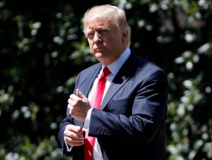 U.S. President Donald Trump walks to Marine One as he departs for a day trip to Kenosha, Wisconsin, from the South Lawn of the White House in Washington, U.S., on April 18, 2017.