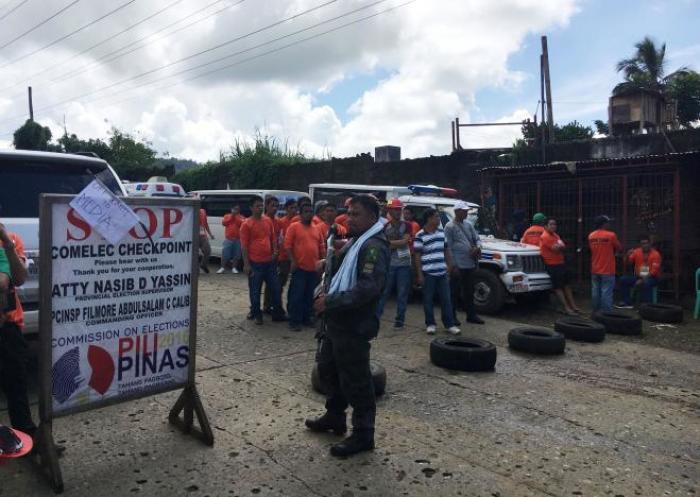 Rescue teams wait at a police checkpoint after gun battles broke a ceasefire and prevented a mass evacuation of civilians in Marawi City, Philippines June 4, 2017.