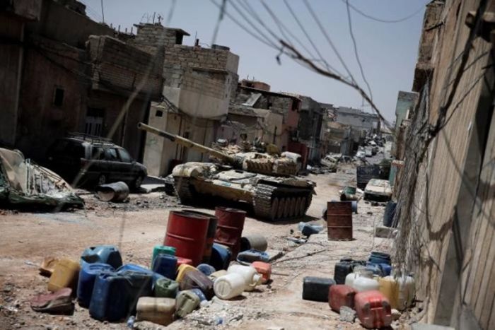 A tank of the Iraqi Army's 9th Armored Division supporting troops fighting ISIS militants is seen at the frontline at the al-Zanjili district in Mosul, Iraq on June 10, 2017.