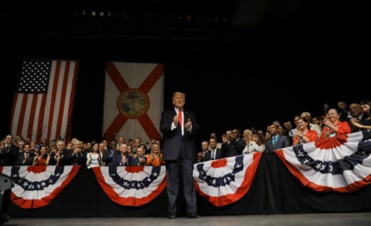 U.S. President Donald Trump applauds as he waits to deliver a speech on US-Cuba relations at the Manuel Artime Theater in Miami, Florida, U.S., June 16, 2017.