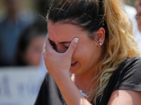 Chaldean-American Lavrena Kenawa cries as she thinks about her uncle who was seized Sunday by Immigration and Customs Enforcement agents during a rally outside the Mother of God Catholic Chaldean church in Southfield, Michigan, U.S., June 12, 2017.