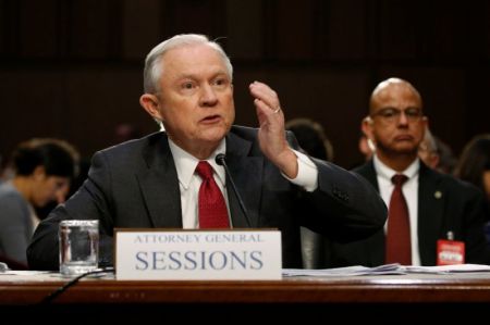 U.S. Attorney General Jeff Sessions reacts to questions from U.S. Senator Ron Wyden (D-OR) as he testifies before a Senate Intelligence Committee hearing on Capitol Hill in Washington, U.S., June 13, 2017.