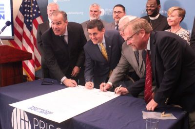 Christian leaders sign the 'Justice Declaration' at the National Press Club in Washington, D.C. on June 20, 2017. From left to right: Prison Fellowship CEO James Ackerman, Southern Baptist ethicist Russell Moore, National Association of Evangelicals President Leith Anderson and Colson Center for Christian Worldview Vice President of Communications David Carlson.