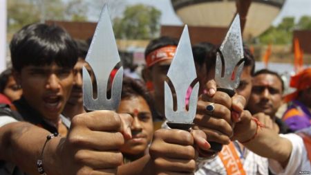 Supporters of hardline Vishwa Hindu Parishad Hindu group hold tridents in the western Indian city of Ahmedabad, India.