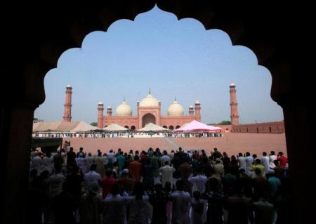 Men say their prayers during Eid al-Fitr at the Badshahi mosque in Lahore, Pakistan.