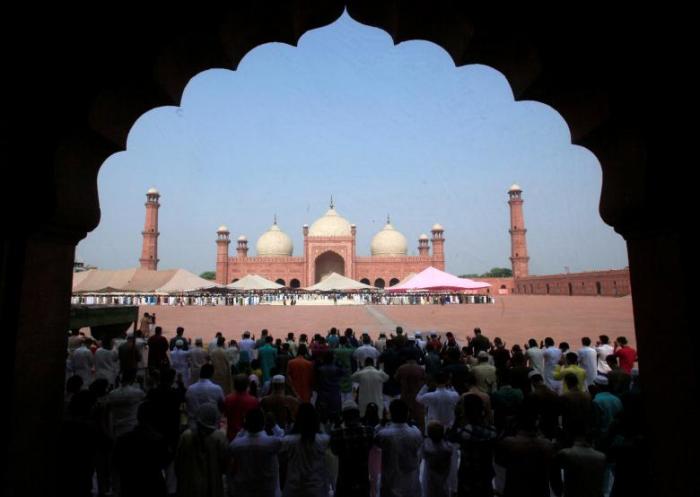 Men say their prayers during Eid al-Fitr at the Badshahi mosque in Lahore, Pakistan.