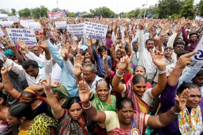 People shout slogans as they attend a protest rally against what they say are attacks on India's low-caste Dalit community in Ahmedabad, India, July 31, 2016.