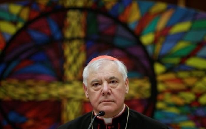 Newly elected cardinal Gerhard Ludwig Muller of Germany smiles as he holds a news conference to unveil his book 'Poor for the Poor: The Mission of the Church,' with the preface written by Pope Francis, in downtown Rome, Italy, February 25, 2014.