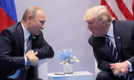 U.S. President Donald Trump speaks with Russian President Vladimir Putin during their bilateral meeting.