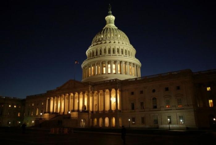 The U.S. Capitol Building is lit at sunset in Washington, U.S., December 20, 2016.