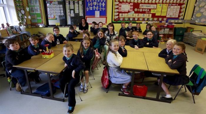 British school children inside their classroom.