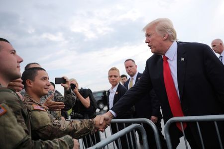 U.S. President Donald Trump greets members of the military as he arrives at Raleigh County Memorial Airport in Beaver, West Virginia, U.S., July 24, 2017.