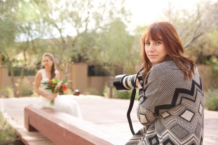 Amy Lawson poses for a photo while taking pictures of a bride in this undated photo.