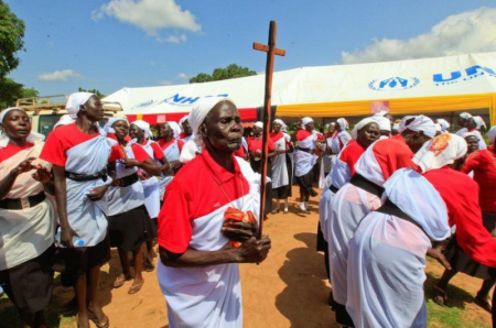 South Sudanese refugees dance during the visit of Archbishop of Canterbury Justin Welby to Mirieyi settlement camp in Adjumani district northwest from Uganda's Capital Kampala, August 2, 2017.