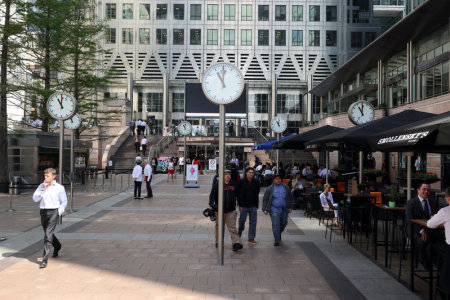 Clocks are seen in London's Financial centre at Canary Wharf In London, Britain as a minute silence is held at 11.00 for the victims of the Manchester bomb attack May 25, 2017.