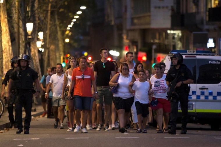 Police evacuate people after a van crashed into pedestrians near the Las Ramblas avenue in central Barcelona, Spain August 17, 2017.